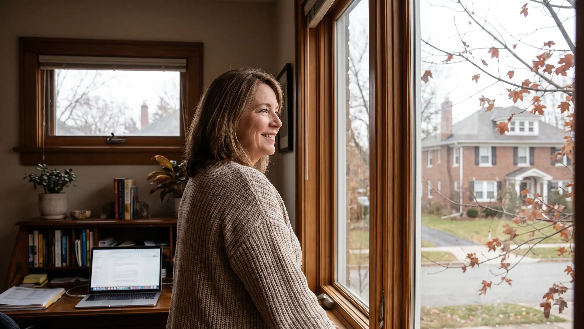 Homeowner weighing whether refinancing in a rising rate environment makes sense from her home office